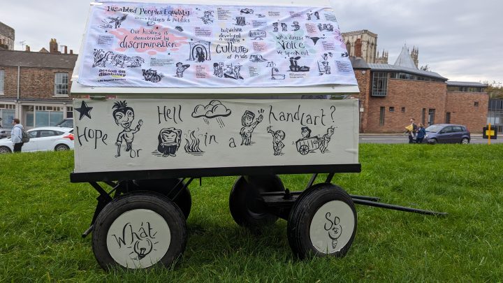 Image of a cart, with various doodles and the words 'hope or hell in a handcart' on the side.
