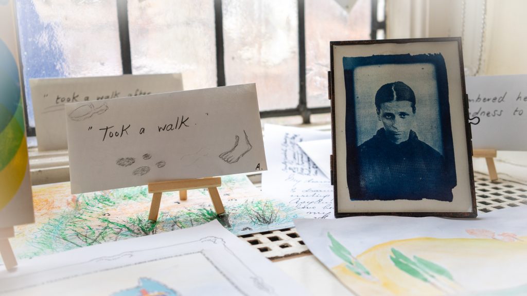 Envelopes, and cyanotype print of woman.